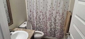 Hair dryer, towels, soap, toilet paper - A blend of comfort and convenience in this cozy, modern 2-bd basement suite. (Saskatoon)