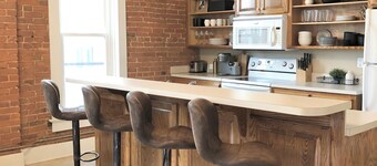 Bright and Spacious Historic Brick Loft off the square in Paola