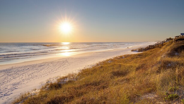A beach with a wooden walkway leading to a building. - Golf Cart, Great Location, Close to Beach Access (Santa Rosa Beach)