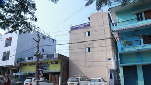 A multi-story building with a sign for Hotel Yogita Inn. - Hotel Yogita Inn  (Gaya)