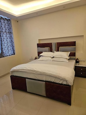 Deluxe Double or Twin Room, Courtyard View | Laptop workspace, iron/ironing board, free WiFi, bed sheets - Ashirwaad249 (Greater Noida)