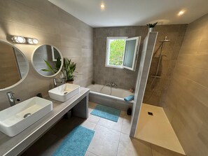 Shower, hair dryer, towels, toilet paper
