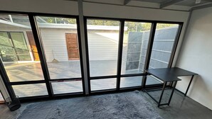 A room with large sliding glass doors leading to an outdoor patio area. - #4 - Private Villa 2BR 1000mbps Wi-fi (Ko Pha-ngan)