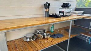 A kitchen with a wooden countertop, stainless steel cookware, and a coffee maker. - #4 - Private Villa 2BR 1000mbps Wi-fi (Ko Pha-ngan)