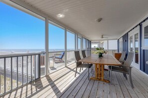 Enjoy dining al fresco on the balcony with a clear view of the surrounding landscape.