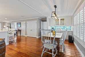Enjoy cooking in this well-equipped kitchen with a central island, stove, and ample cabinetry.