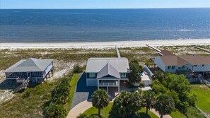 Relax in a serene beachfront setting with unobstructed ocean views from the patio area.