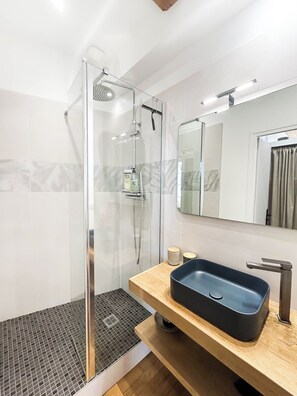 Shower, hair dryer, towels, soap