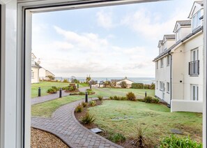Stunning views of a distant body of water from the windows of this beautifully maintained home.