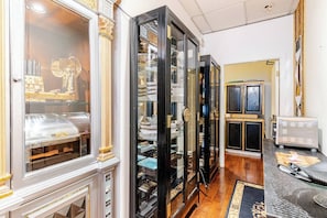 Classic hallway with glass-fronted cabinets and ornate details.