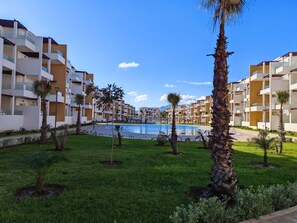 Property grounds - Light & Airy Family apartment with private pools & excellent local beaches (Cabo Negro)