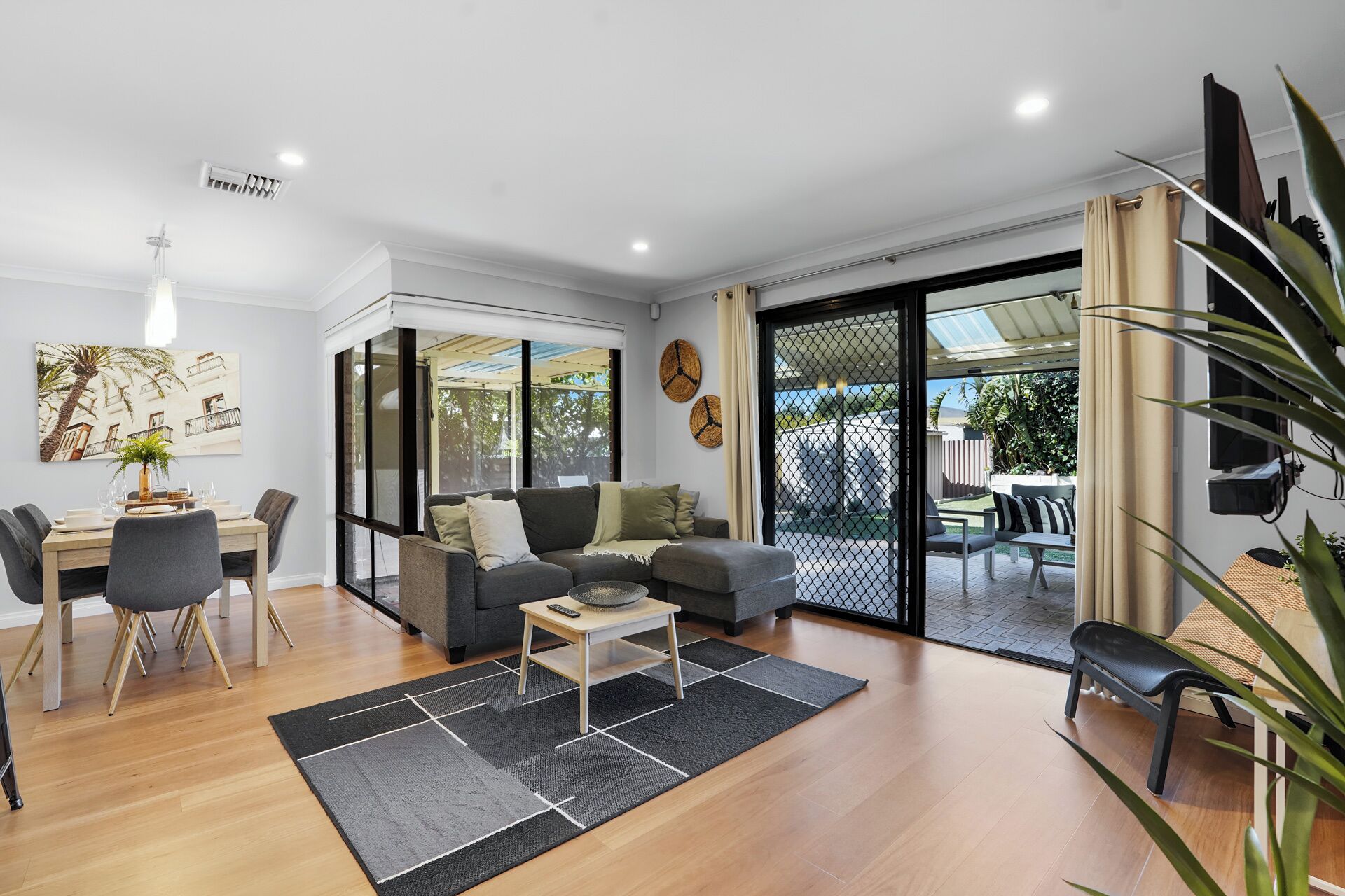Bright open-plan living and dining area with outdoor access