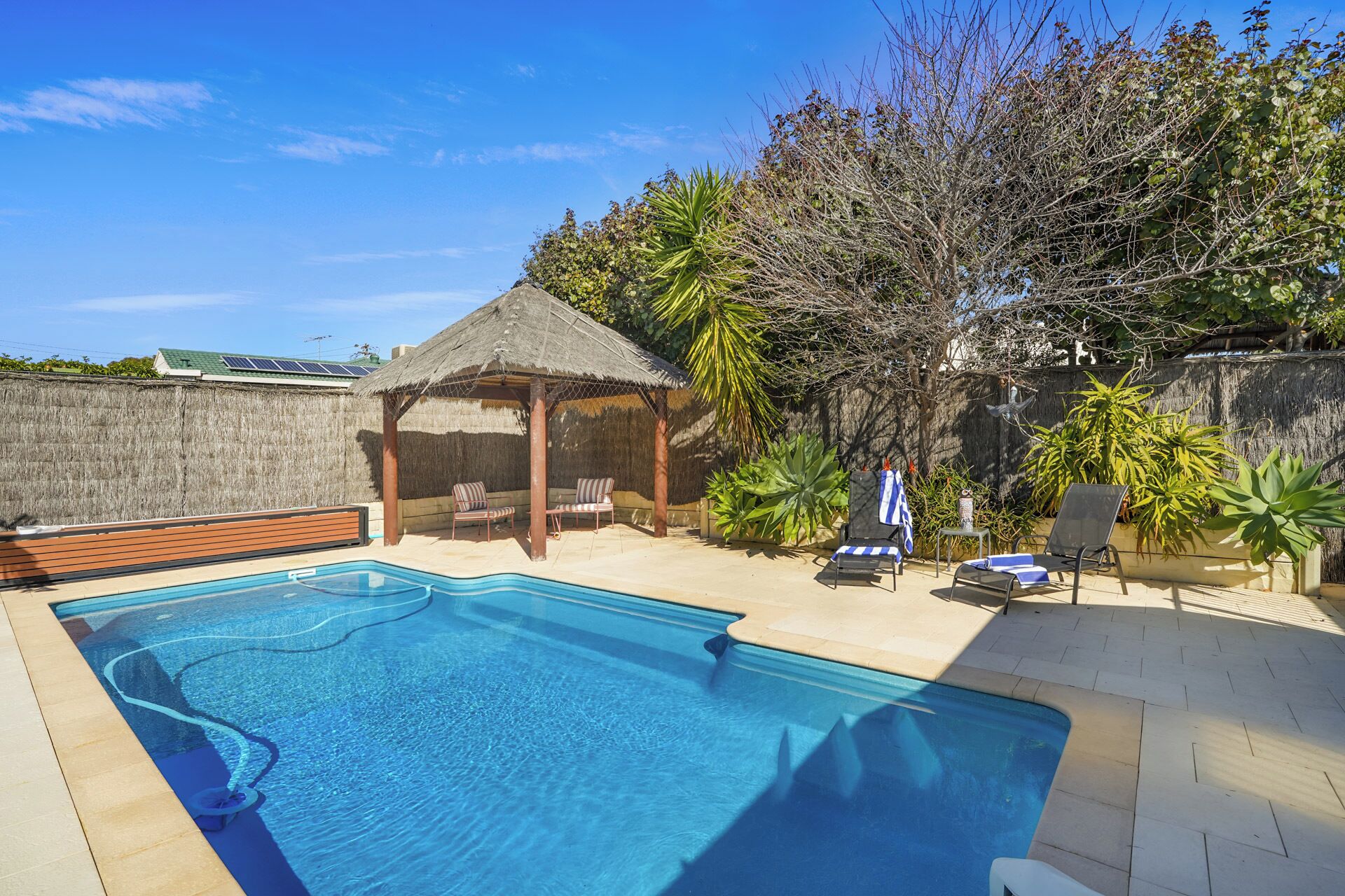 Private pool surrounded by lush outdoor space