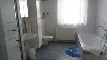 Shower, hair dryer, towels, toilet paper