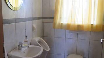 Shower, hair dryer, towels, toilet paper