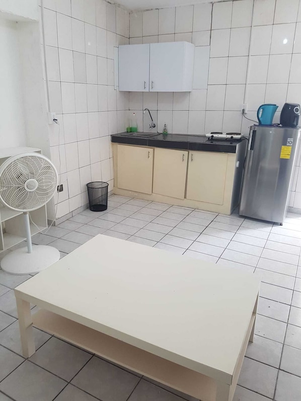 Fridge, electric kettle, cookware/dishes/utensils, spices