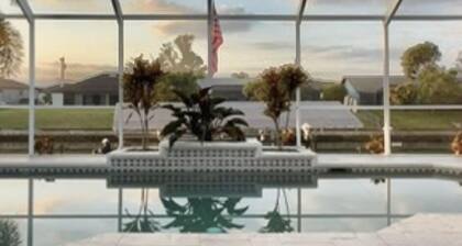 Your Oasis Awaits: Stunning Canal-Front Home w/Heated Pool,Dock & Hi-Speed WiFi!