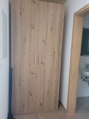 Shower, hair dryer, towels, toilet paper