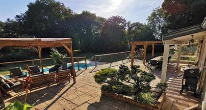 Large country house with heated pool, wooded grounds, lovely terrace.