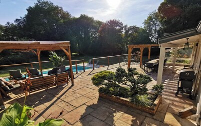 Large country house with heated pool, wooded grounds, lovely terrace.