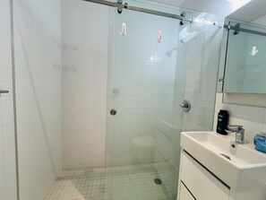 Shower, hair dryer, towels, soap