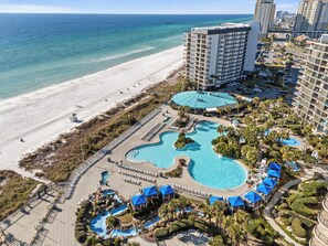 A resort with multiple swimming pools, a beach, and a view of the ocean. - Ocean View! Golf Course! Pool! Edgewater Resort! (Panama City Beach)