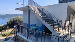 A modern building with a staircase leading to a balcony. - Charming 2-bedroom house with AC, WiFi in amazing Corfu






 (Corfu)