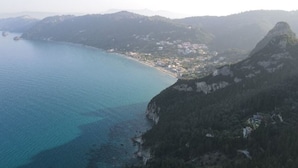 A coastal town with a beach and mountainous terrain. - Charming 2-bedroom house with AC, WiFi in amazing Corfu






 (Corfu)