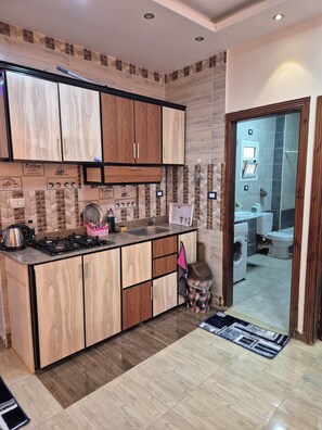 Family Apartment, Balcony, City View | Private kitchen | Full-size fridge, oven, stovetop, electric kettle - Star Apartment Hurghada (Hurghada)