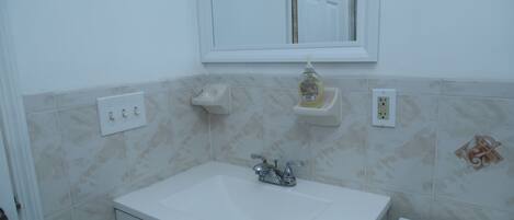Bidet, towels, soap, toilet paper