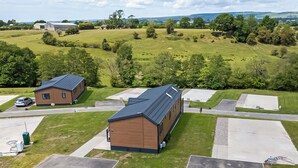 A large building with a flat roof, surrounded by green fields and trees. - 2 bedroom accommodation in Old Langho, Ribble Valley (Old Langho, Ribble Valley)