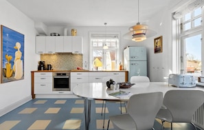 Fridge, dishwasher, coffee/tea maker, cookware/dishes/utensils