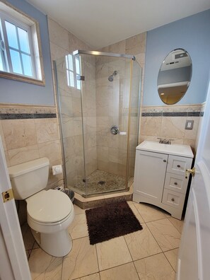 Shower, hair dryer, towels, soap