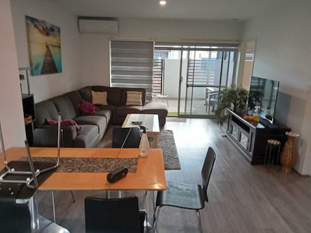 Living area. Nice 2 bedrooms and 1 bathroom apartment in the south east of the Perth City.