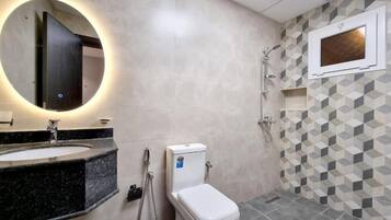 Shower, towels, soap, toilet paper