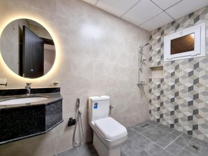 Shower, towels, soap, toilet paper