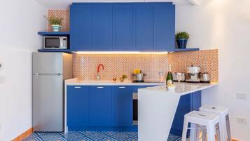 Apartamento | Cozinha privada | Geladeira, fogão, cooktop, cafeteira/chaleira