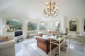 Villa | Living area | Smart TV, fireplace, video-game console, books