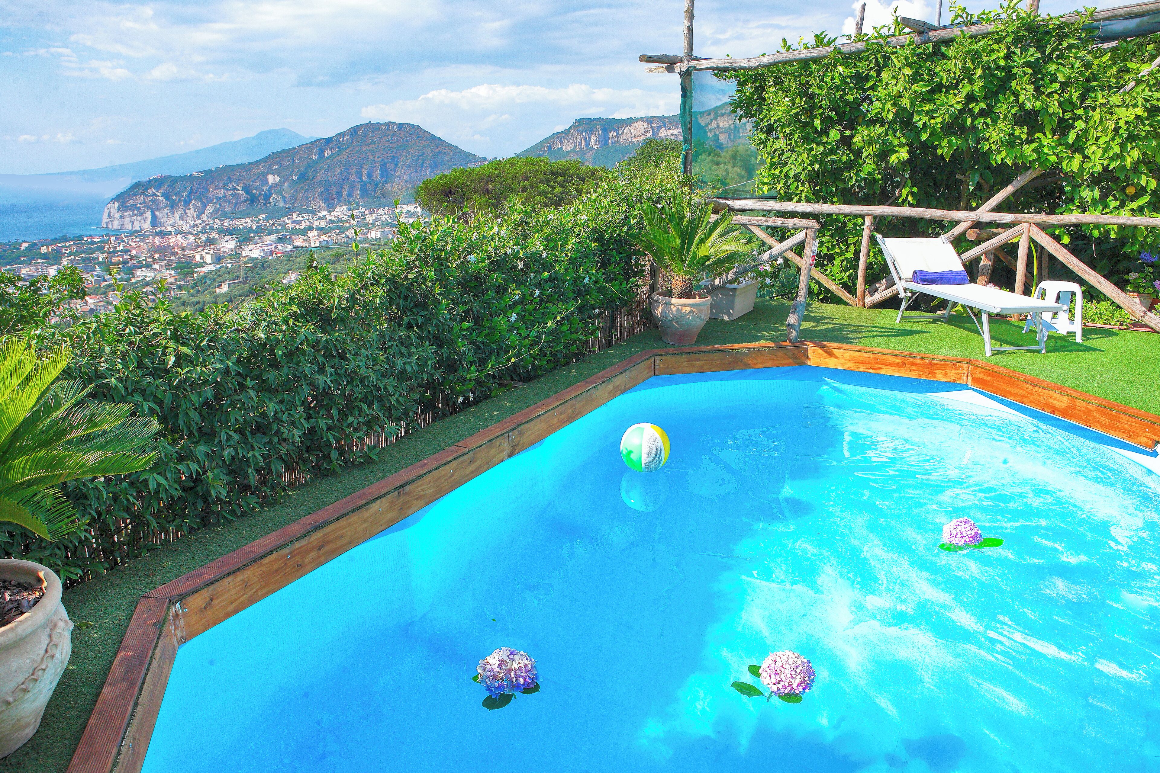 Seasonal outdoor pool, pool umbrellas, pool loungers