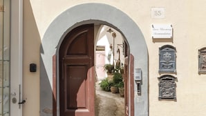 An arched doorway leading to a building labeled "Tuere Charming Accommodation." - Luxury New Sorrento Home With Terrace - Sleeps 12 (Sorrento)