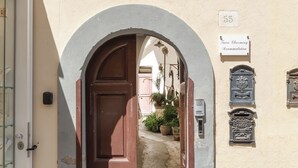 An arched doorway leading to a building labeled 'Tuere Charming Accommodation' with a number '55' above it. - Lux Family Home In Sorrento With Terrace/Solarium (Sorrento)