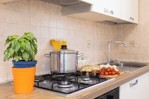 Villa | Private kitchen | Full-size fridge, oven, stovetop, dishwasher