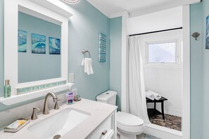 Shower, hair dryer, towels, shampoo