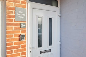 A door with a sign reading "The Parade View" and a keypad lock.