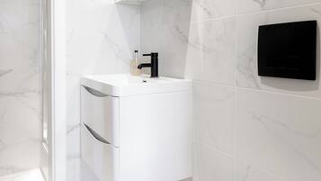 Shower, hair dryer, towels, soap