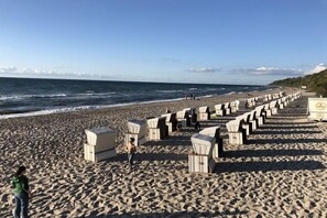Seating areas line the beach, offering a planned space for gatherings.