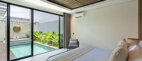 A modern bedroom with a large bed, a view of a swimming pool, and a ceiling with a woven design.