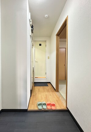 Enter a serene space with a comfortable place to leave your shoes.