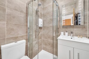 Shower, hair dryer, towels, soap