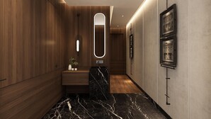 A modern hallway with wooden paneling, a marble-topped sink, and framed artwork on the walls. - Citadines Connect Bertam Georgetown Penang (George Town)